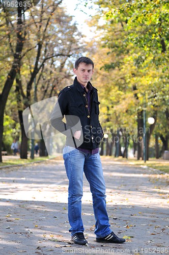 Image of happy young casual man outdoor portrait posing