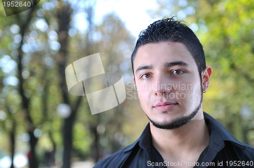 Image of happy young casual man outdoor portrait posing