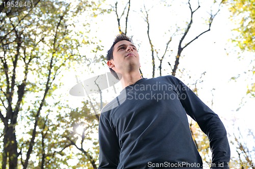 Image of happy young casual man outdoor portrait posing