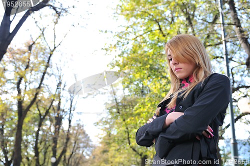 Image of brunette Cute young woman posing outdoors