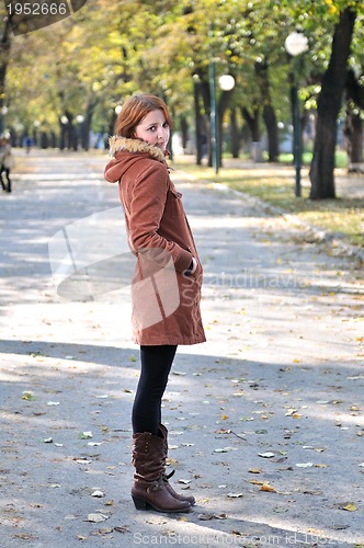 Image of brunette Cute young woman with piercing posing outdoors