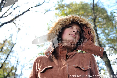 Image of brunette Cute young woman with piercing posing outdoors