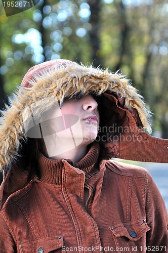 Image of brunette Cute young woman with piercing posing outdoors