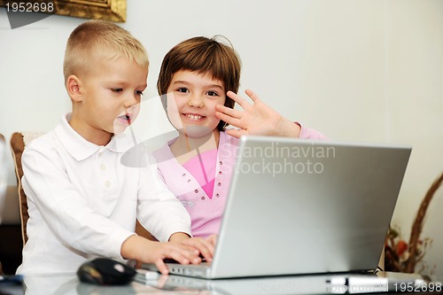 Image of childrens have fun and playing games on laptop computer