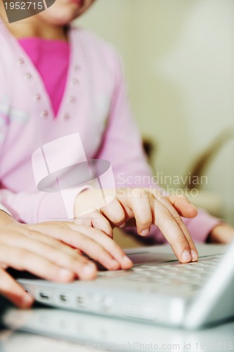 Image of childrens have fun and playing games on laptop computer