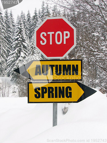 Image of autumn or spring roadsign at cold winter day