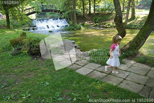 Image of wooden bring over small waterfall 