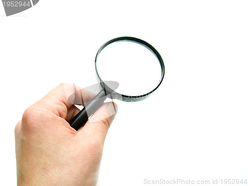 Image of hand with magnifying glass