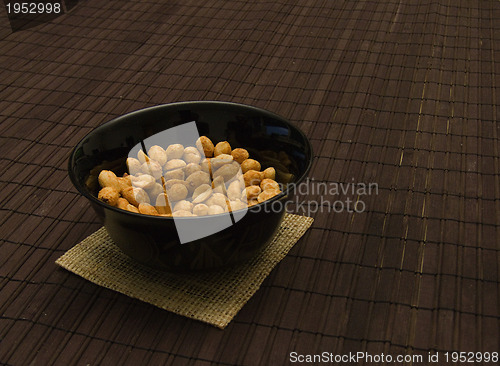 Image of peanuts in black can