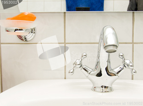 Image of retro tap and orange soap