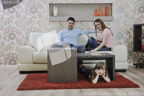 Image of happy young family at home