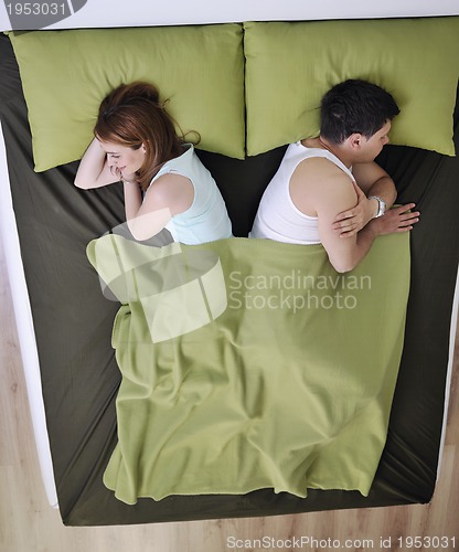 Image of young couple in bed