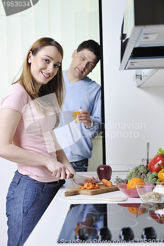 Image of couple have fun and preparing healthy food in kitchen