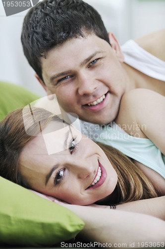 Image of young couple in bed