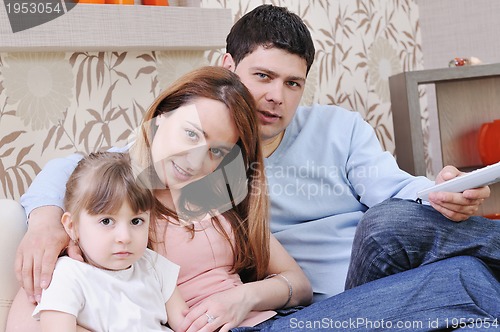 Image of happy young family at home