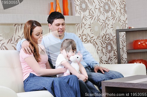 Image of happy young family at home