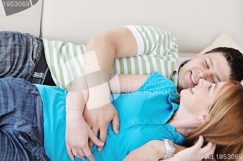 Image of couple relax at home on sofa