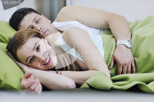 Image of young couple in bed