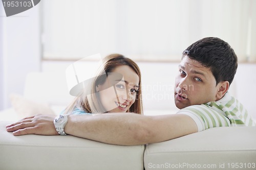 Image of couple relaxing at home