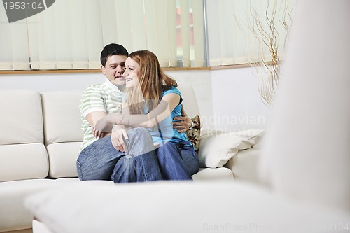 Image of couple relaxing at home