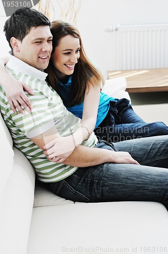 Image of couple relaxing at home