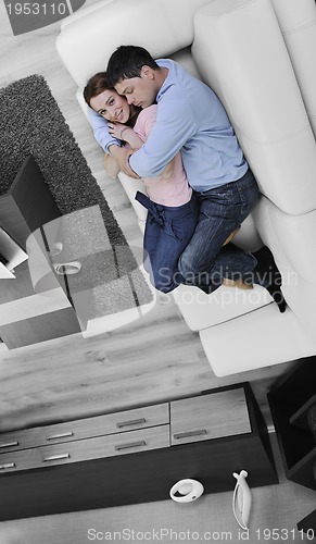Image of couple relaxing at home