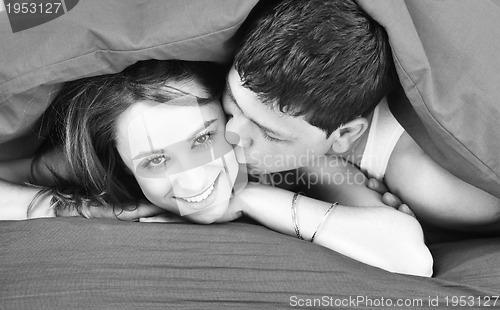 Image of young couple in bed