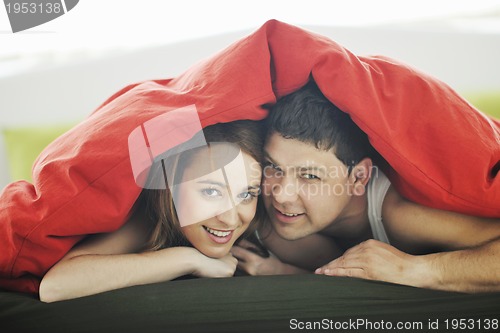 Image of young couple in bed