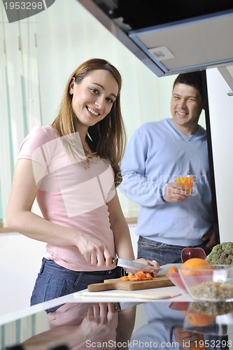 Image of couple have fun and preparing healthy food in kitchen