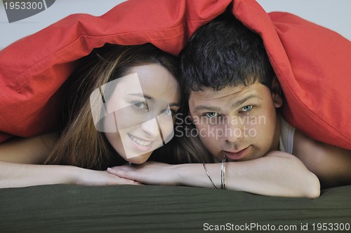 Image of young couple in bed