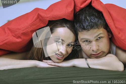 Image of young couple in bed