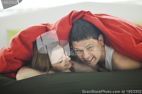 Image of young couple in bed