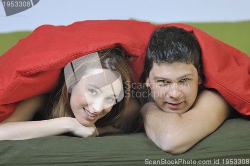 Image of young couple in bed