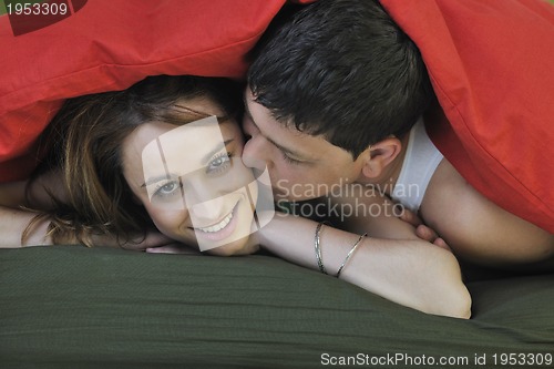 Image of young couple in bed