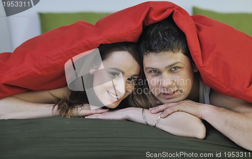 Image of young couple in bed