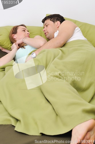 Image of young couple in bed