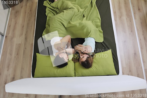 Image of young couple in bed