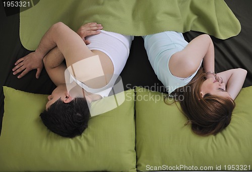 Image of young couple in bed