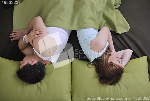 Image of young couple in bed
