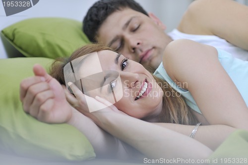 Image of young couple in bed