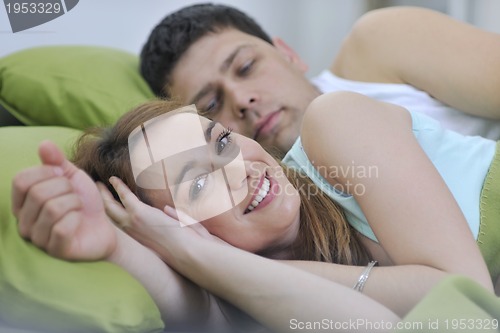 Image of young couple in bed