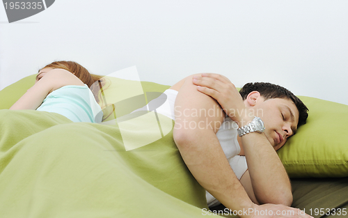 Image of young couple in bed