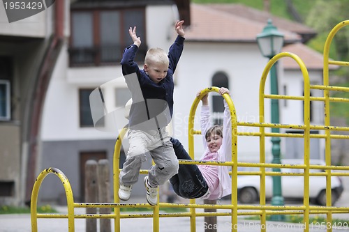 Image of happy brother and sister outdoor in park