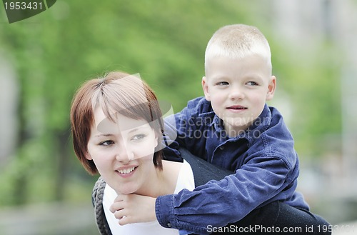 Image of happy boy and mom outdoor