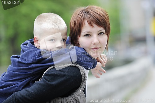 Image of happy boy and mom outdoor