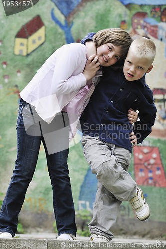 Image of happy brother and sister outdoor in park