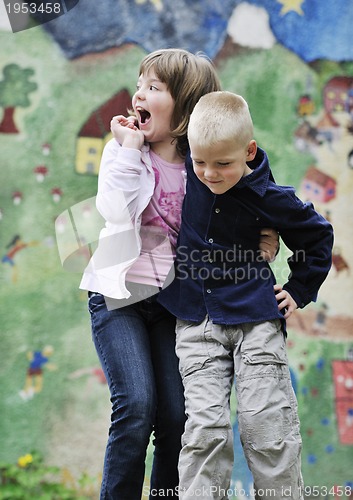 Image of happy brother and sister outdoor in park