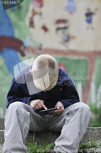 Image of playing video games outdoor