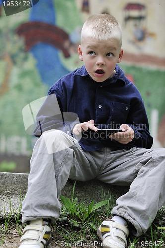 Image of playing video games outdoor