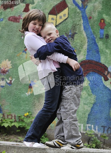 Image of happy brother and sister outdoor in park